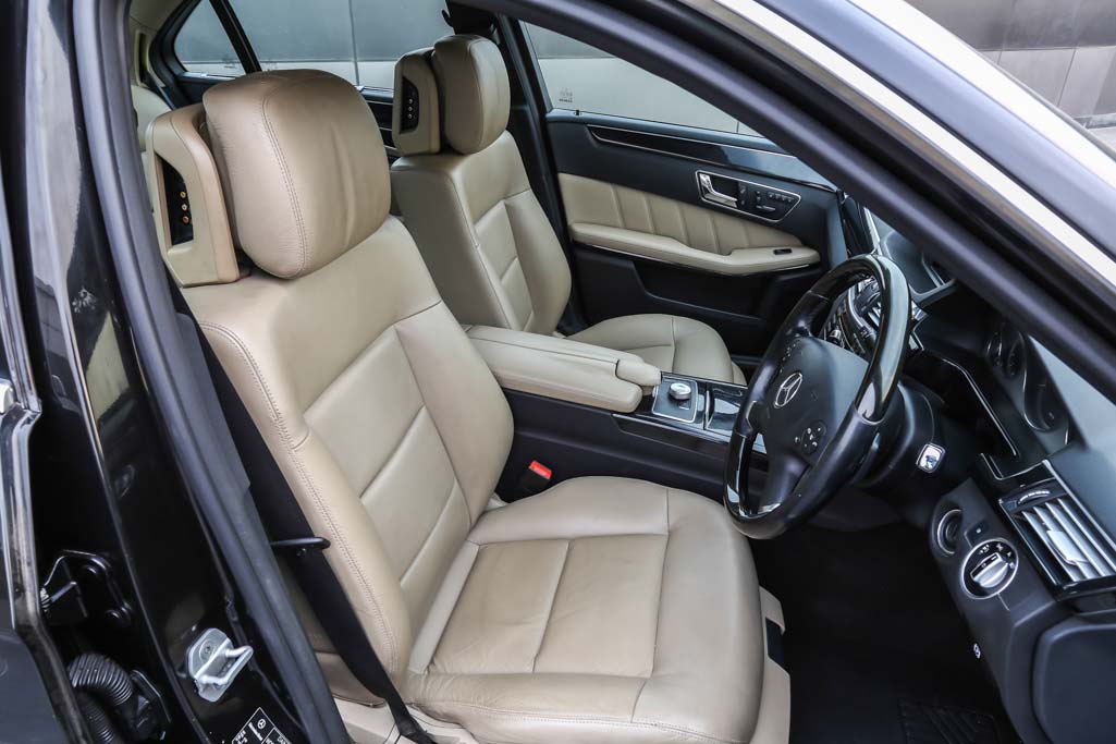 Mercedes Benz E350 CDI door view of front seats